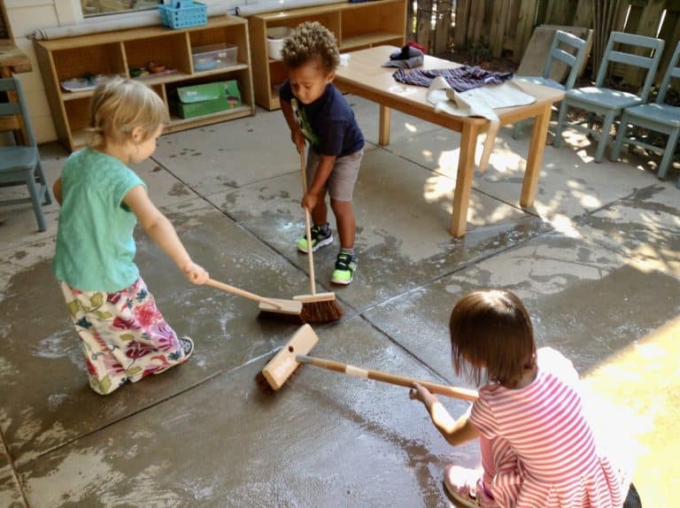 montessori students play while getting work done