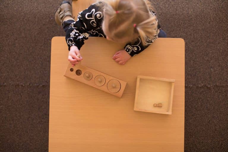 child learning how to arrange blocks