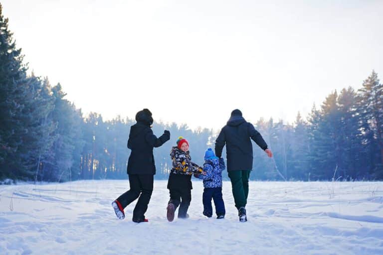 family celebrating holiday season outdoors