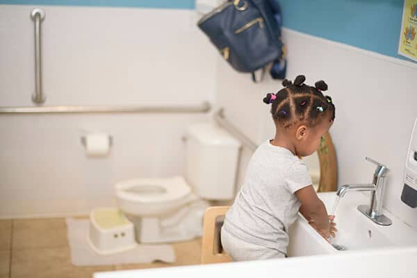 a child going through toilet learning the montessori way